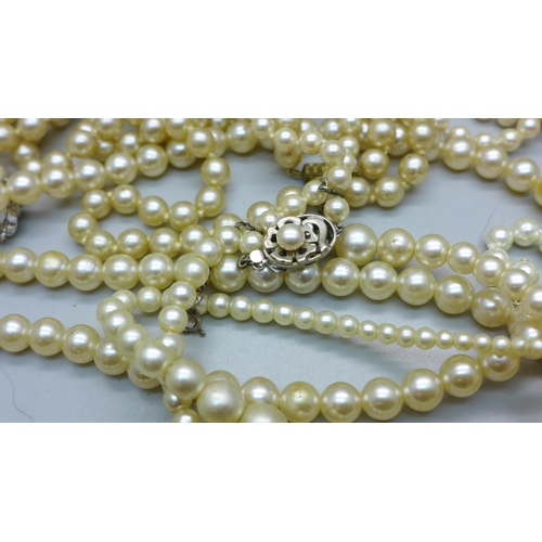 889 - A collection of pearls including silver mounted, Lotus and faux