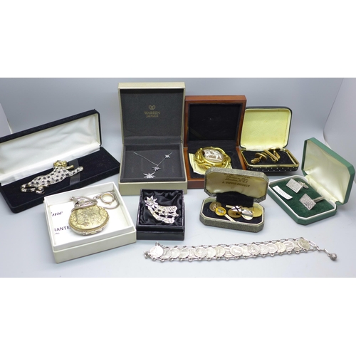 890 - A silver pendant and chain, a coin bracelet, a pair of silver cufflinks, a panther brooch, a cameo b... 