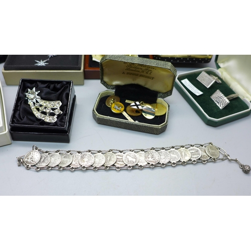 890 - A silver pendant and chain, a coin bracelet, a pair of silver cufflinks, a panther brooch, a cameo b... 