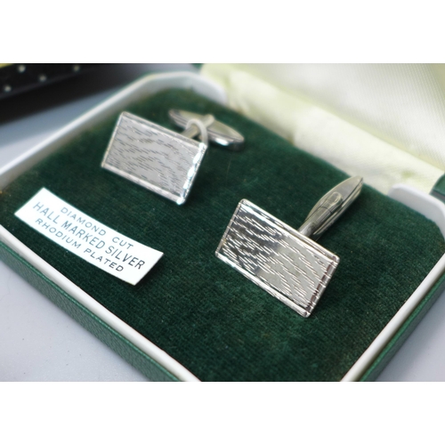 890 - A silver pendant and chain, a coin bracelet, a pair of silver cufflinks, a panther brooch, a cameo b... 