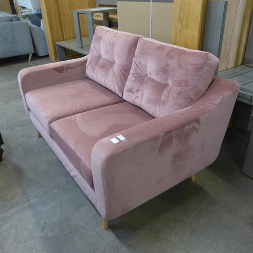 1487 - An 'Old Rose' velvet upholstered two seater sofa