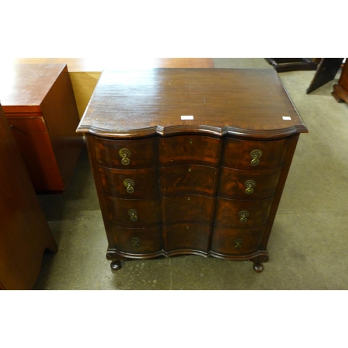 102 - A Queen Anne style mahogany and figured walnut chest of drawers