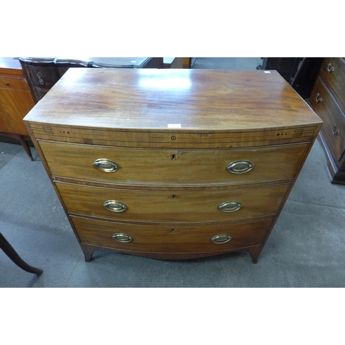 103 - A George III inlaid mahogany bow front chest of drawers