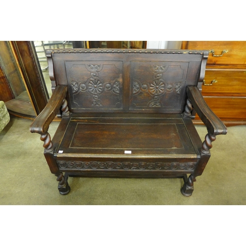 106 - A Victorian Jacobean Revival carved oak barleytwist monk's bench