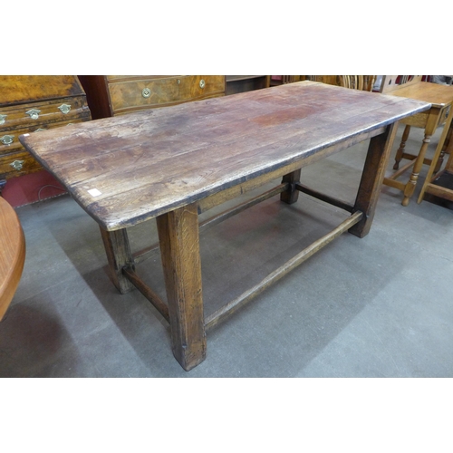 111 - A 19th Century style French oak plank top refectory table