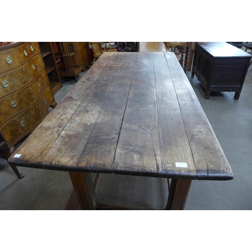 111 - A 19th Century style French oak plank top refectory table