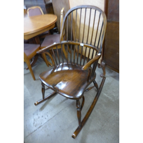 113 - A 19th Century style elm Windsor rocking chair