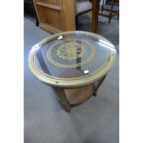 121 - An Art Deco walnut and glass topped circular coffee table