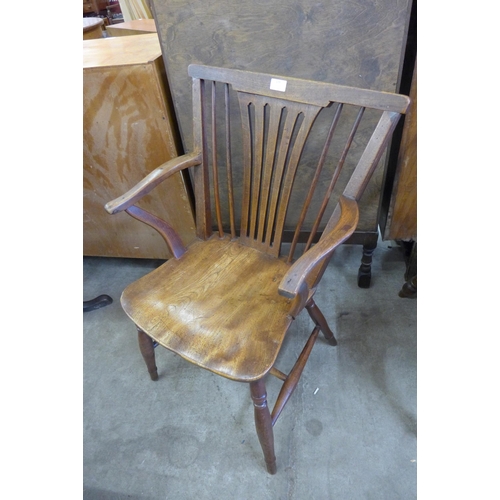 128 - An 18th Century elm and fruitwood elbow chair