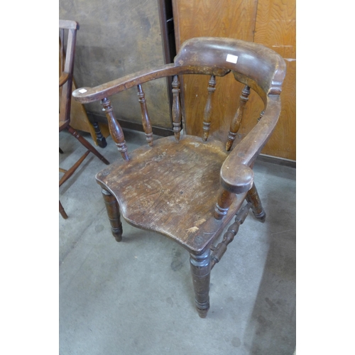 129 - An early 20th Century elm and beech smokers bow chair