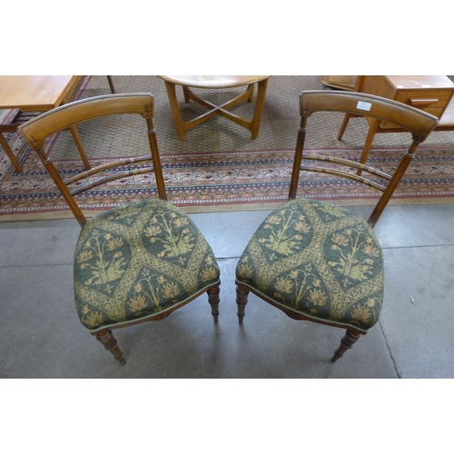 130 - A pair of Victorian satinwood side chairs