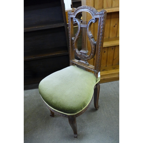 131 - A 19th Century French carved walnut lyre back harpists chair and an Art Deco walnut stool