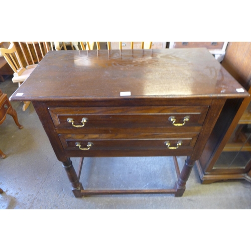 139 - A George III style Ipswich oak two drawer side table