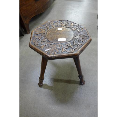 140 - A carved oak stool