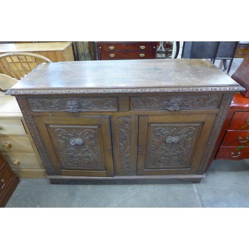 152 - A Victorian carved oak green man dresser