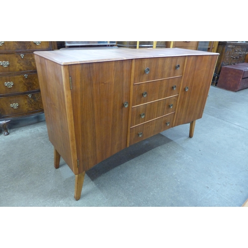 15B - An afromosia concave sideboard