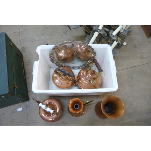 257 - Three copper kettles, a copper jug, a vase and a tray