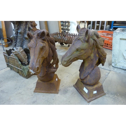 260 - A pair of cast iron horse's head garden ornaments