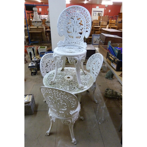 265 - A cast alloy garden table and four chairs