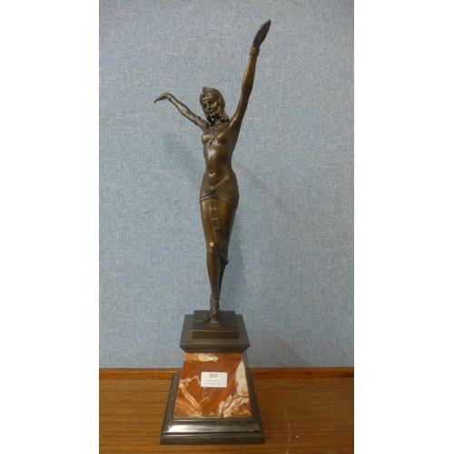 303 - An Art Deco style bronze figure of a female dancer ,on rouge marble socle