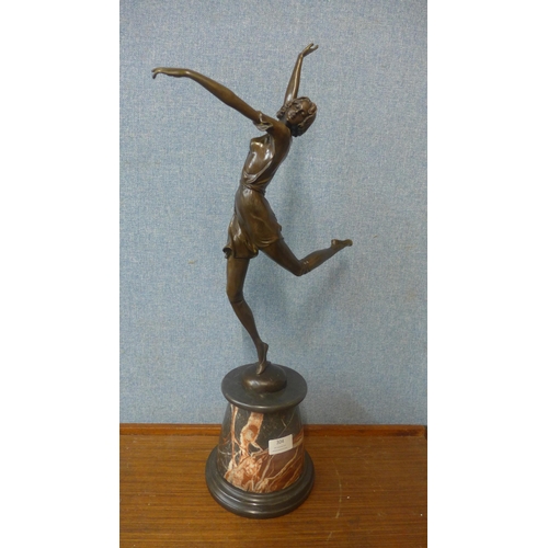 304 - An Art Deco style bronze figure of a female dancer, on rouge marble socle