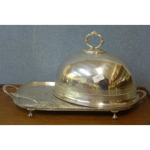 307 - A plated meat dome, a serving tray and a cake slice