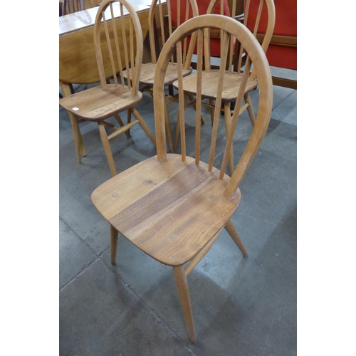 31 - A set of four Ercol elm and beech Windsor chairs