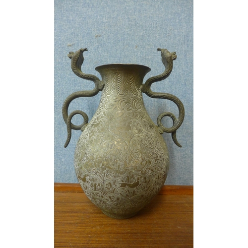 312 - An Islamic brass two handled vase