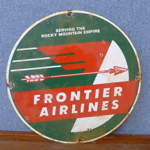 320 - An enamelled circular Frontier Airlines advertising sign