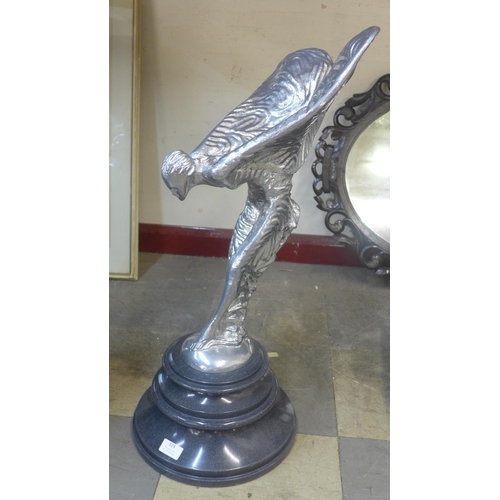 323 - A large chrome effect Spirit of Ecstasy figure, on black marble socle