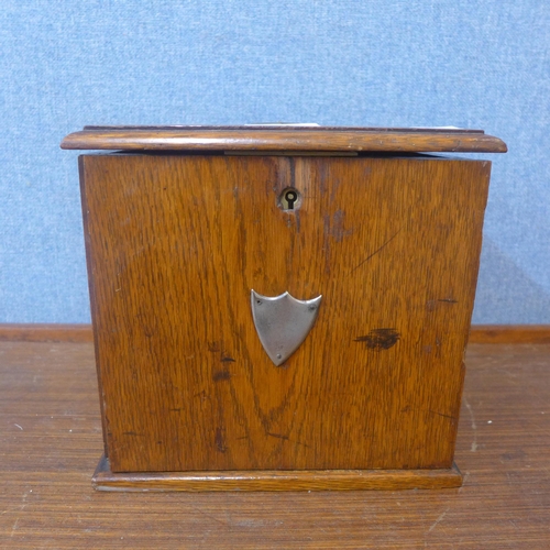 326 - An early 20th Century oak smokers cabinet