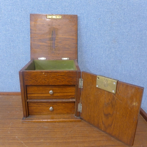 326 - An early 20th Century oak smokers cabinet