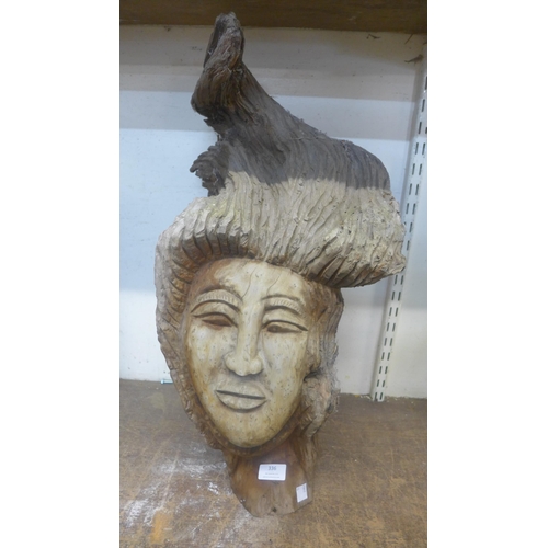 336 - An oriental carved driftwood bust