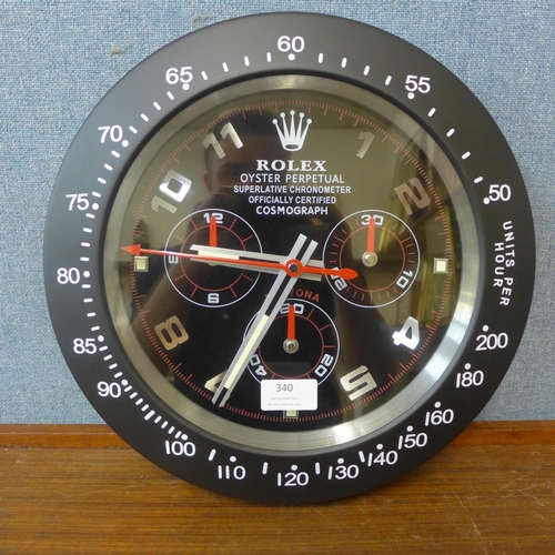 340 - A Rolex style dealer's display wall clock