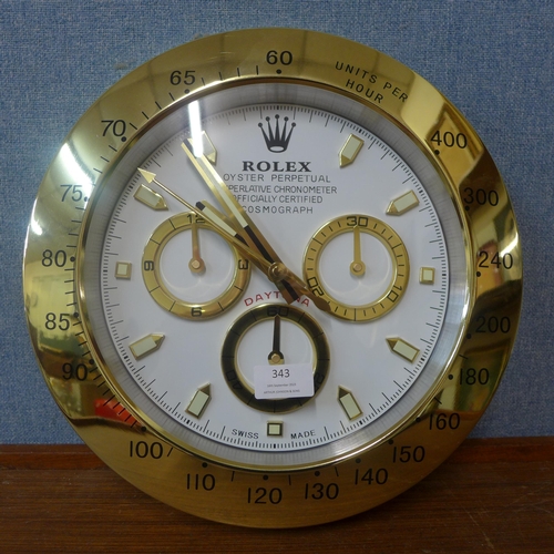 343 - A Rolex style dealer's display wall clock