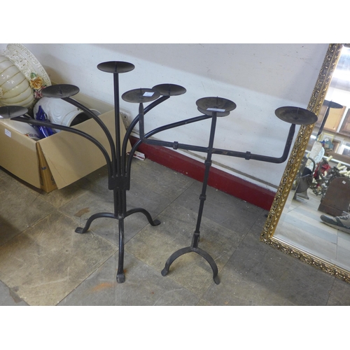 345 - Two painted steel candle stands