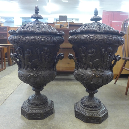 349 - A pair of large Baroque style bronze two handled urns and covers