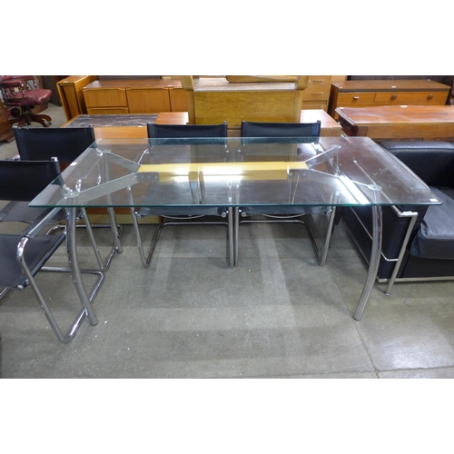 68A - An Italian chrome and glass topped dining table and six chrome and black vinyl cantilever chairs