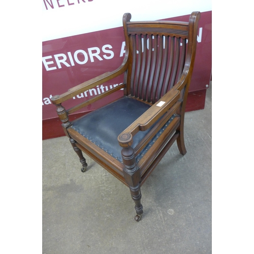 73 - An Arts and Crafts walnut library chair, manner of E.W. Godwin