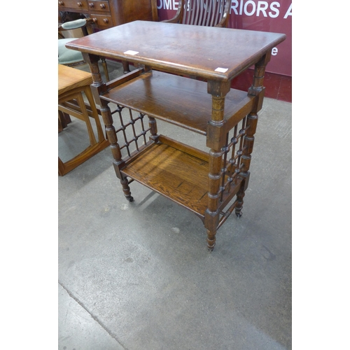 74 - An Arts and Crafts Liberty & Co. oak reading stand, designed by Leonard Wyburd