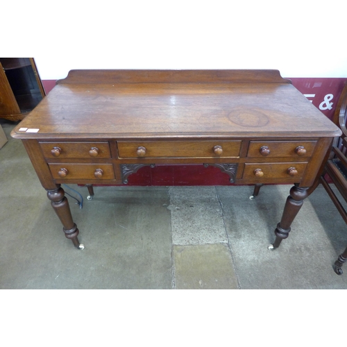 77 - A Victorian mahogany five drawer writing table