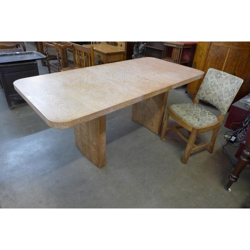 78 - An Art Deco Heals limed oak extending dining table and a chair. Table dimensions; 76cms h, 138cms l ... 