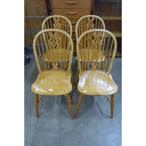 82 - A set of four ash crinoline stretcher Windsor chairs