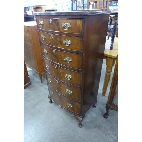 98 - A George I style flame figured mahogany bow front chest of drawers