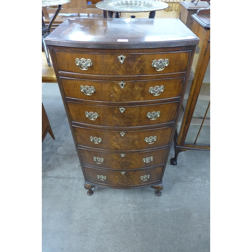 98 - A George I style flame figured mahogany bow front chest of drawers