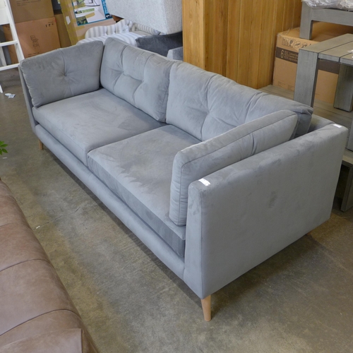 1488 - A grey velvet upholstered button back three seater sofa