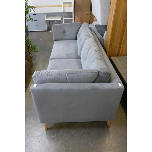 1488 - A grey velvet upholstered button back three seater sofa