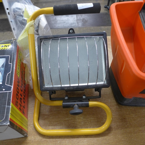 A Black Decker power spreader and two halogen floodlights