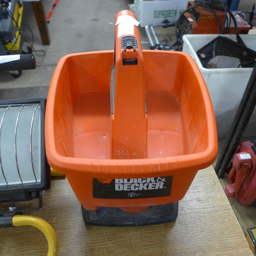 A Black Decker power spreader and two halogen floodlights