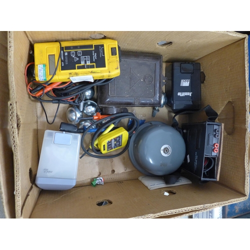 2052 - A box of misc. items including meters, bell, metal light protectors, petrol cans, etc.